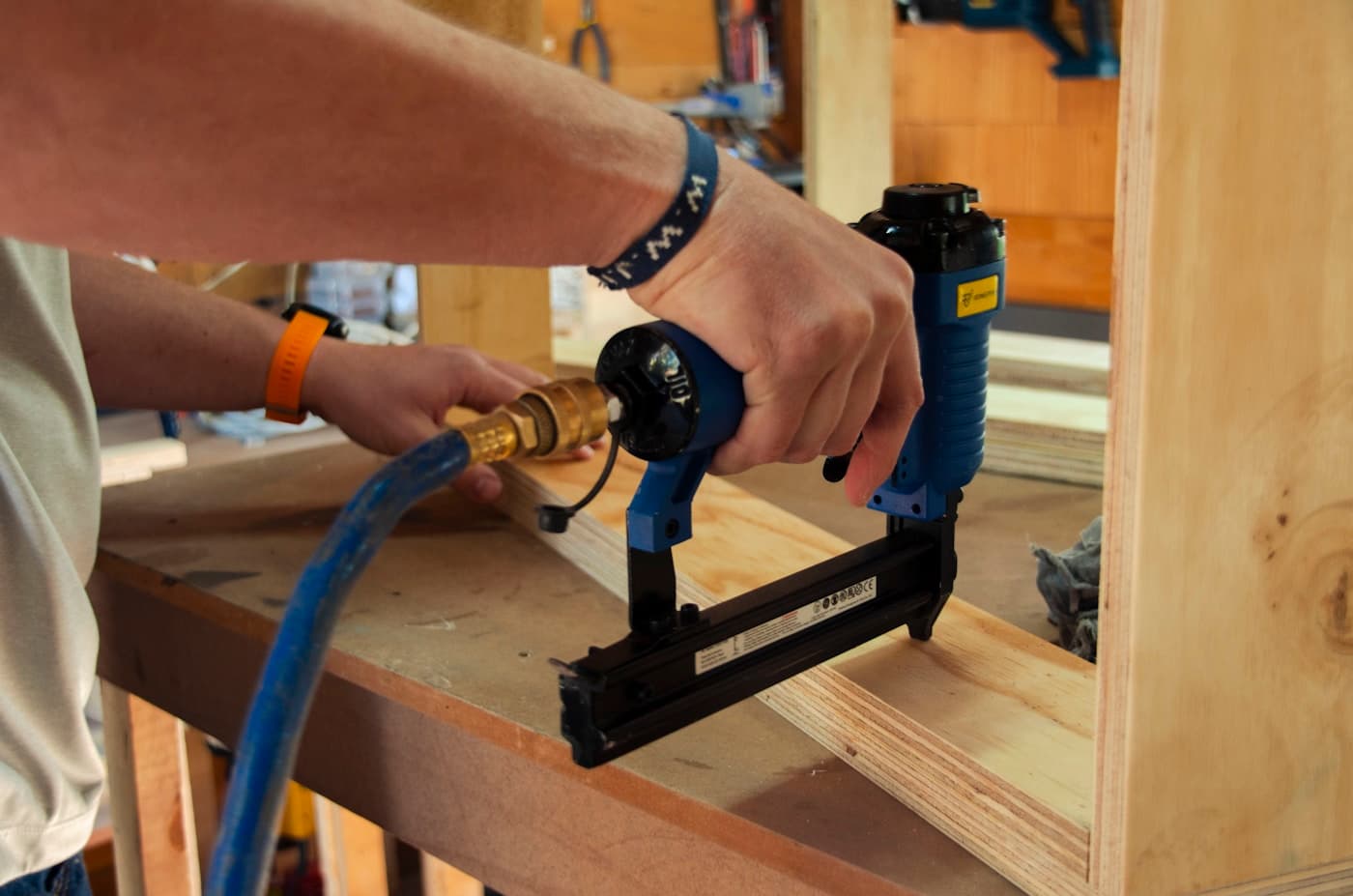 Person using a power drill on wood